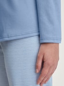 Women model is wearing Pyjamas, long made of 100% Cotton in Blue, Striped from the Midnight Stripes series by CALIDA, Detail