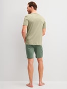 Men model is wearing Short pyjamas made of Cotton in Green, Unicoloured from the Relax Superlight series by CALIDA, Back view