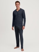 Men model is wearing Pyjamas, long made of 100% Cotton in Blue, Patterned from the Relax Streamline series by CALIDA, Front view