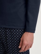 Men model is wearing Pyjamas, long made of 100% Cotton in Blue, Patterned from the Relax Streamline series by CALIDA, Detail