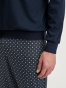 Men model is wearing Pyjama with cuff made of 100% Cotton in Blue, Patterned from the Relax Streamline series by CALIDA, Detail