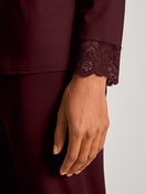 Women model is wearing Pyjamas, long made of Modal in Red, Lace from the Season Special series by CALIDA, Detail