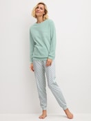 Women model is wearing Pyjama with cuff made of 100% Cotton in Turquoise, Patterned from the Sweet Dreams series by CALIDA, Front view