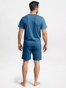 Men model is wearing Short pyjamas made of 100% Cotton in Blue, Unicoloured from the Nightwear Xtra series by CALIDA, Back view