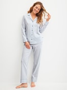 Women model is wearing Button-Up Pyjama made of 100% Cotton in Blue, Striped from the Striped Dreams series by CALIDA, Front view