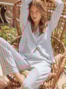 Women model is wearing Button-Up Pyjama made of 100% Cotton in Blue, Striped from the Striped Dreams series by CALIDA, Front view