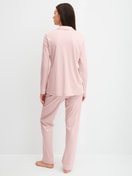 Women model is wearing Button-Up Pyjama made of 100% Cotton in Pink, Unicoloured from the Night Lovers series by CALIDA, Back view