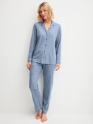 Women model is wearing Button-Up Pyjama made of 100% Cotton in Blue, Unicoloured from the Night Lovers series by CALIDA, Front view