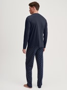 Men model is wearing Pyjamas, long made of 100% Cotton in Blue, Patterned from the Relax Selected 4 series by CALIDA, Back view
