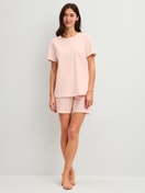Women model is wearing Short pyjama made of 100% Cotton in Pink, Patterned from the Easter Nights series by CALIDA, Front view