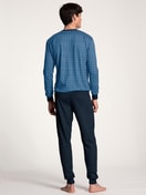Men model is wearing Pyjama with cuff made of 100% Cotton in Blue, Patterned from the Nightwear Xtra series by CALIDA, Back view