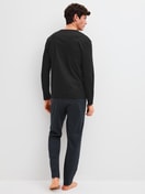 Men model is wearing Pyjamas, long made of 100% Cotton in Black, Patterned from the Relax Streamline 2 series by CALIDA, Back view