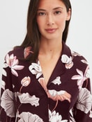 Women model is wearing Button-Up Pyjama made of 100% Cotton in Red, Floral from the Season Special series by CALIDA, Detail