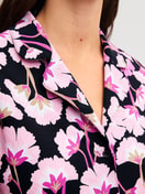 Women model is wearing Button-Up Pyjama made of 100% Cotton in Pink, Floral from the Autumn Dreams series by CALIDA, Detail