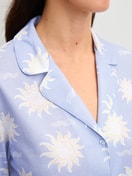 Women model is wearing Button-Up Pyjama made of 100% Cotton in Blue, Patterned from the EDITION 85 series by CALIDA, Detail