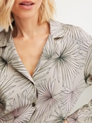 Women model is wearing Button-Up Pyjama made of 100% Cotton in Green, Floral from the Leaf Dreams series by CALIDA, Detail