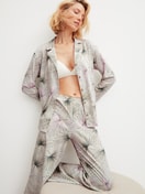 Women model is wearing Button-Up Pyjama made of 100% Cotton in Green, Floral from the Leaf Dreams series by CALIDA, Additional Image