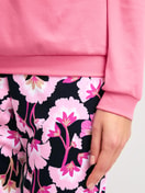 Women model is wearing Pyjama with cuff made of 100% Cotton in Pink, Floral from the Autumn Dreams series by CALIDA, Detail