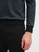 Men model is wearing Pyjama with cuff made of 100% Cotton in Black, Patterned from the Relax Streamline 2 series by CALIDA, Detail