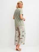 Women model is wearing 7/8 - Pyjamas made of 100% Cotton in Green, Floral from the Leaf Dreams series by CALIDA, Back view