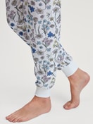 Women model is wearing Pyjama with cuff made of 100% Cotton in Blue, Floral from the Flower Nights series by CALIDA, Detail