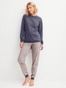 Women model is wearing Pyjama with cuff made of 100% Cotton in Blue, Patterned from the Graphic Nights series by CALIDA, Front view