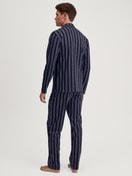 Men model is wearing Button-Up Pyjama made of 100% Cotton in Blue, Striped from the Relax Streamline 4 series by CALIDA, Back view