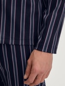 Men model is wearing Button-Up Pyjama made of 100% Cotton in Blue, Striped from the Relax Streamline 4 series by CALIDA, Detail