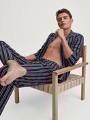 Men model is wearing Button-Up Pyjama made of 100% Cotton in Blue, Striped from the Relax Streamline 4 series by CALIDA, Front view