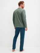 Men model is wearing Pyjamas, long made of 100% Cotton in Green, Patterned from the Relax Imprint 1 series by CALIDA, Back view