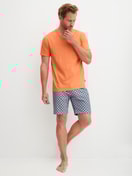 Men model is wearing Short pyjama made of 100% Cotton in Orange, Patterned from the Relax Imprint 4 series by CALIDA, Front view