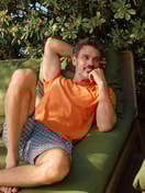 Men model is wearing Short pyjama made of 100% Cotton in Orange, Patterned from the Relax Imprint 4 series by CALIDA, Front view