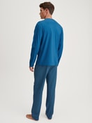 Men model is wearing Pyjamas, long made of 100% Cotton in Blue, Patterned from the Relax Imprint 2 series by CALIDA, Back view