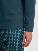 Men model is wearing Pyjamas, long made of 100% Cotton in Turquoise, Patterned from the Relax Imprint 3 series by CALIDA, Detail
