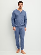 Men model is wearing cuffed pyjamas made of 100% Cotton in Blue, Unicoloured from the Relax Choice 1 series by CALIDA, Front view