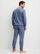 Men model is wearing cuffed pyjamas made of 100% Cotton in Blue, Unicoloured from the Relax Choice 1 series by CALIDA, Back view