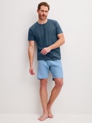 Men model is wearing Short pyjama made of 100% Cotton in Blue, Patterned from the Cotton Special series by CALIDA, Front view