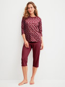 Women model is wearing Capri Pyjama made of 100% Cotton in Red, Patterned from the Cotton Special series by CALIDA, Front view