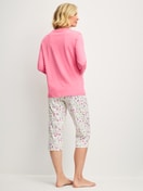 Women model is wearing Capri Pyjama made of 100% Cotton in Pink, Patterned from the Cotton Special series by CALIDA, Back view