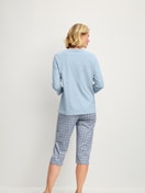 Women model is wearing Capri Pyjama made of 100% Cotton in Grey, Patterned from the Cotton Special series by CALIDA, Back view