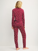 Women model is wearing Pyjamas, long made of 100% Cotton in Red, Patterned from the Cotton Special series by CALIDA, Back view