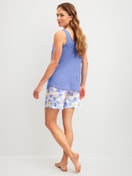 Women model is wearing Short pyjama made of 100% Cotton in Blue, Floral from the Coastal Dreams series by CALIDA, Back view