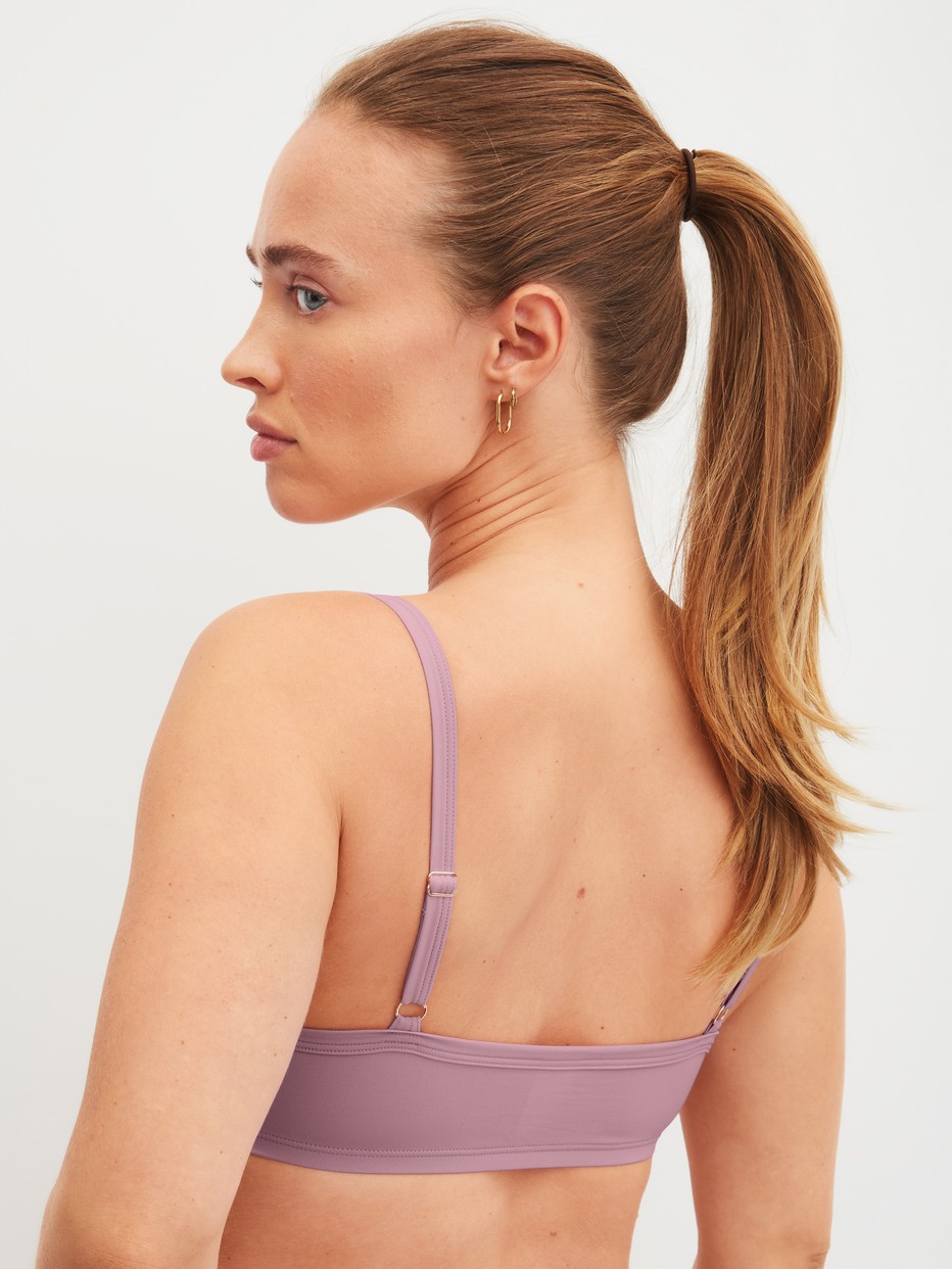 Damen-Model trägt Bustier aus Polyamid in Rosa, Einfarbig aus Serie Eco Sense Special von CALIDA, Rückansicht