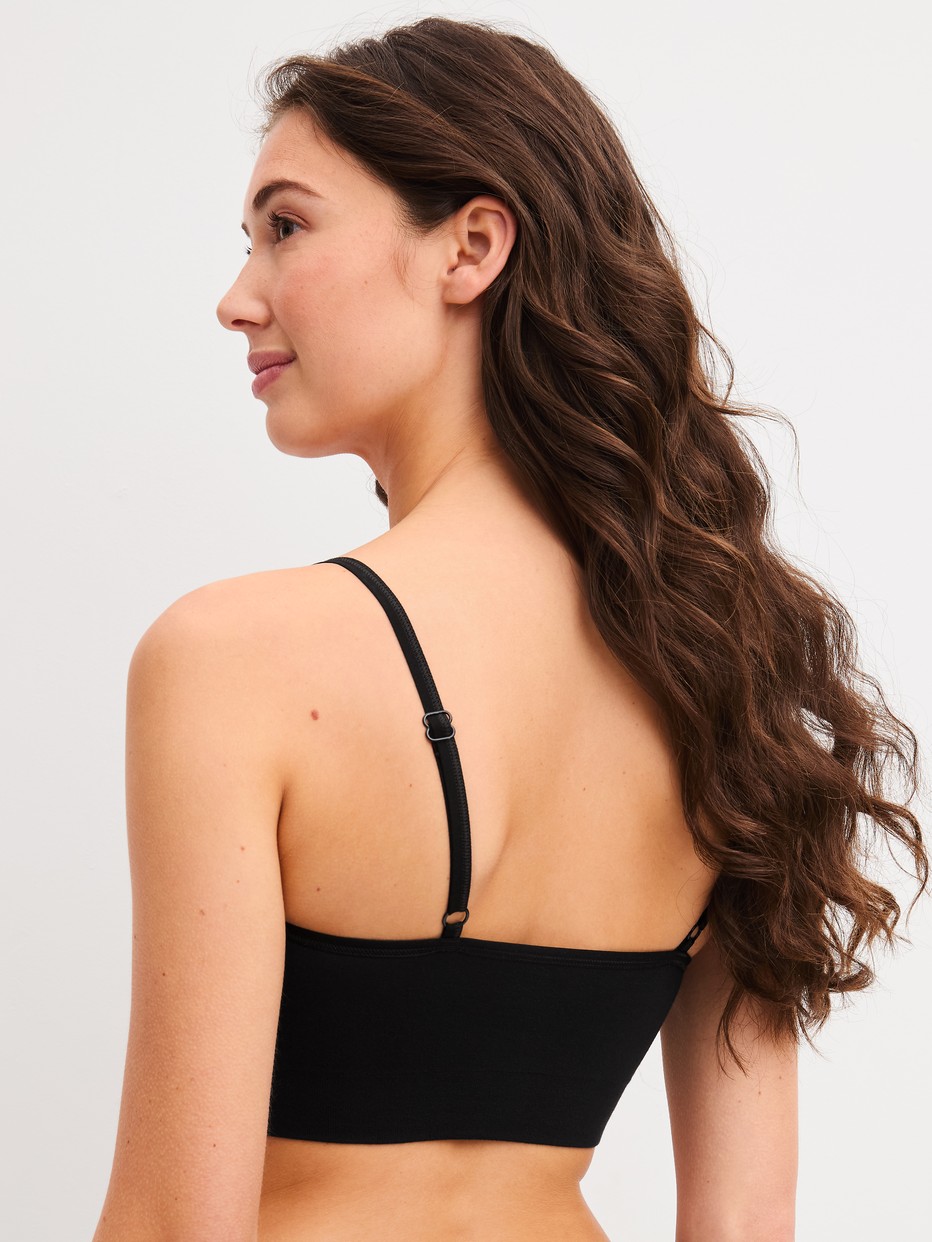 La modella / Il modello Donna indossa Bustier in Modal di colore Nero, Tinta unita, della serie Seamless Natural di CALIDA, Vista posteriore