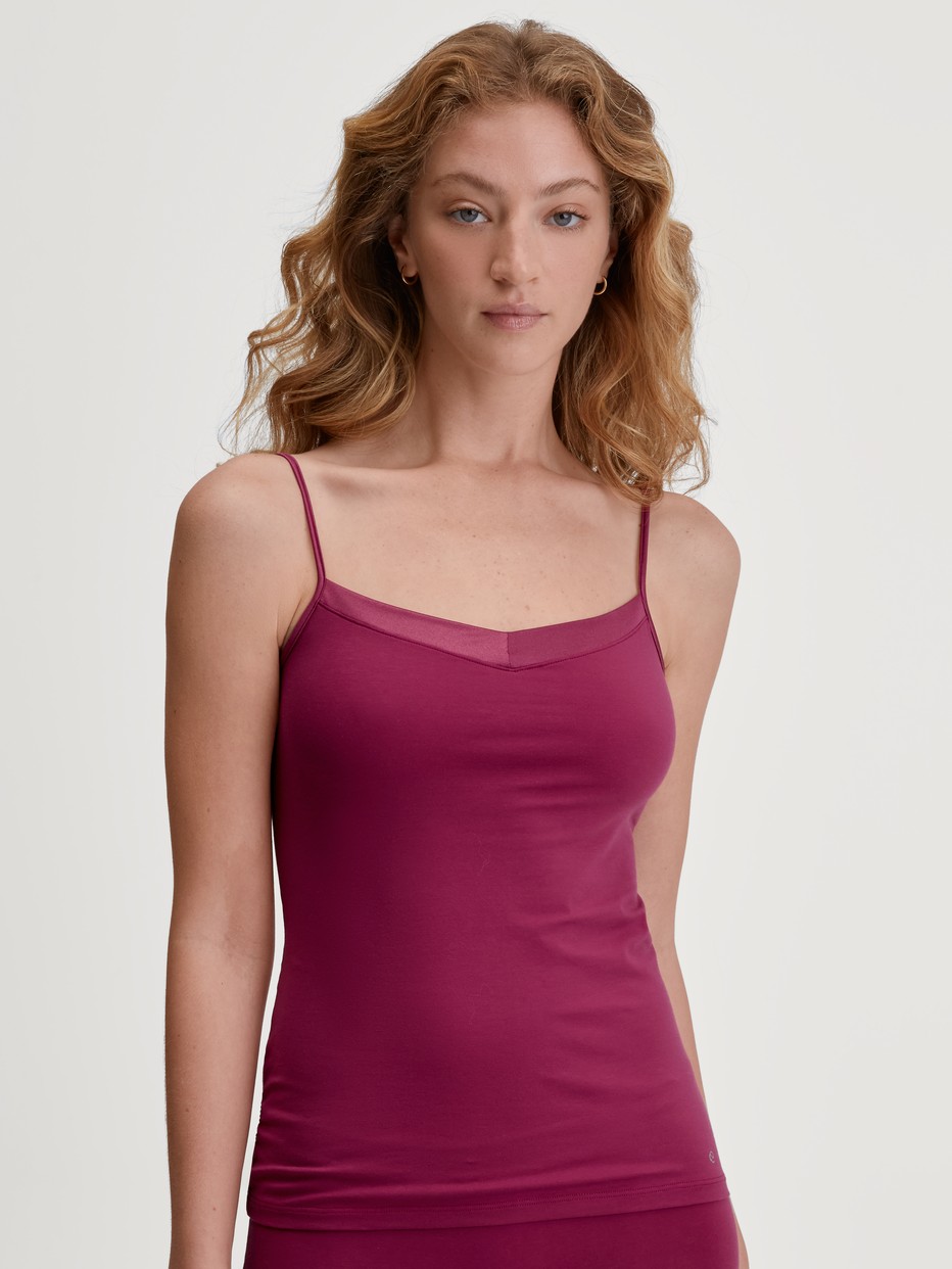 Women model is wearing Spaghetti top made of 100% Cotton in Pink, Unicoloured from the Cate series by CALIDA, Front view