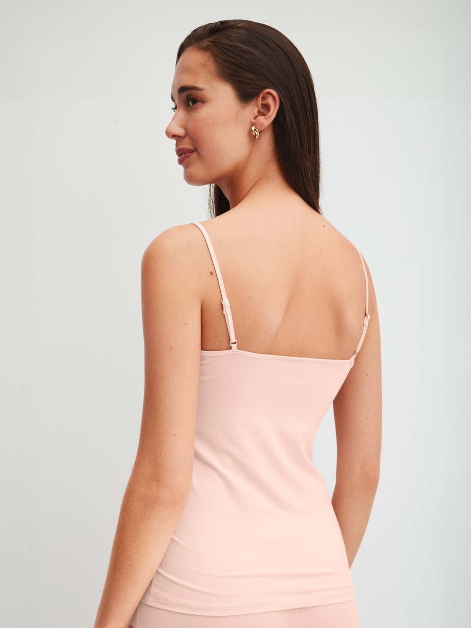 Women model is wearing Spaghetti top made of Cotton in Pink, Unicoloured from the Cate series by CALIDA, Back view