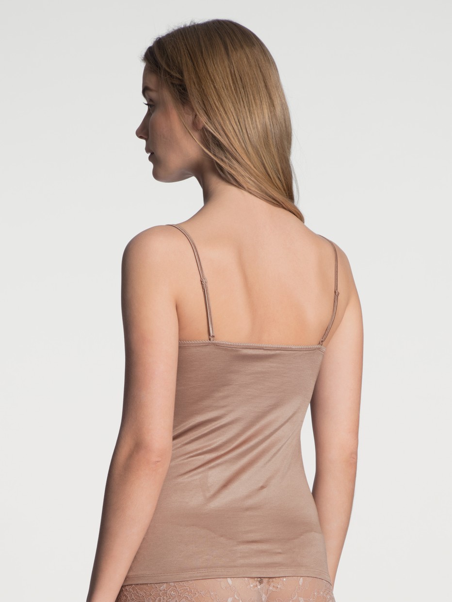 Women model is wearing Spaghetti strap top with lace made of Viscose in Beige, Unicoloured from the Sensual Secrets series by CALIDA, Back view