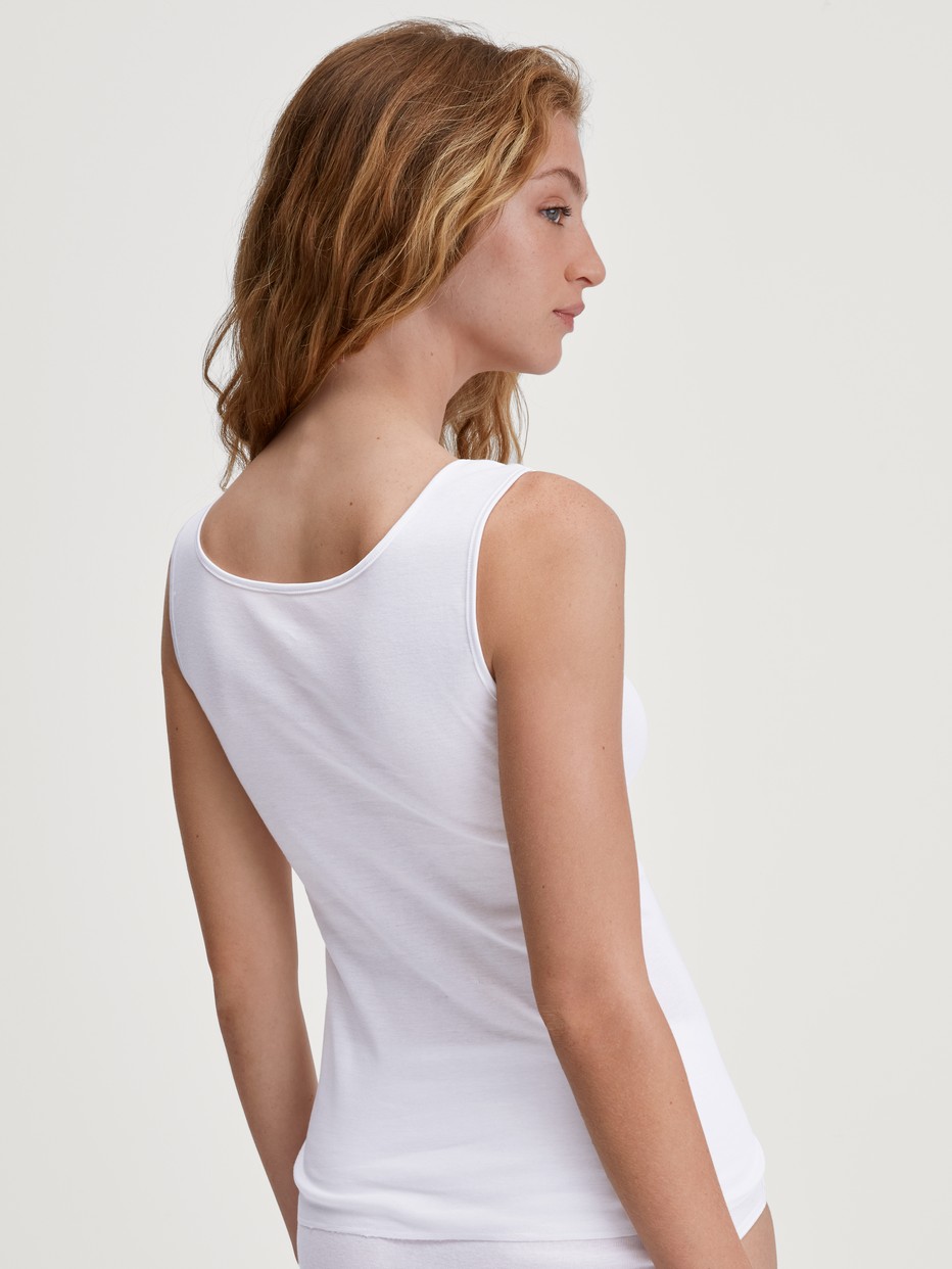 Women model is wearing Tank top made of 100% Cotton in White, Lace from the Cotton Desire series by CALIDA, Back view
