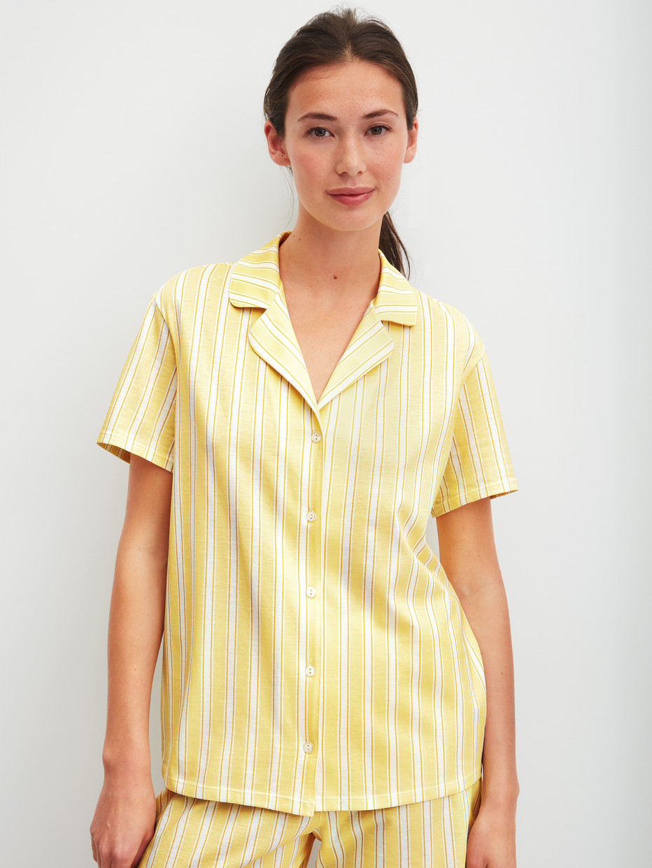 Women model is wearing Short-sleeved shirt with buttons made of 100% Cotton in Yellow, Striped from the Favourites Ocean series by CALIDA, Front view