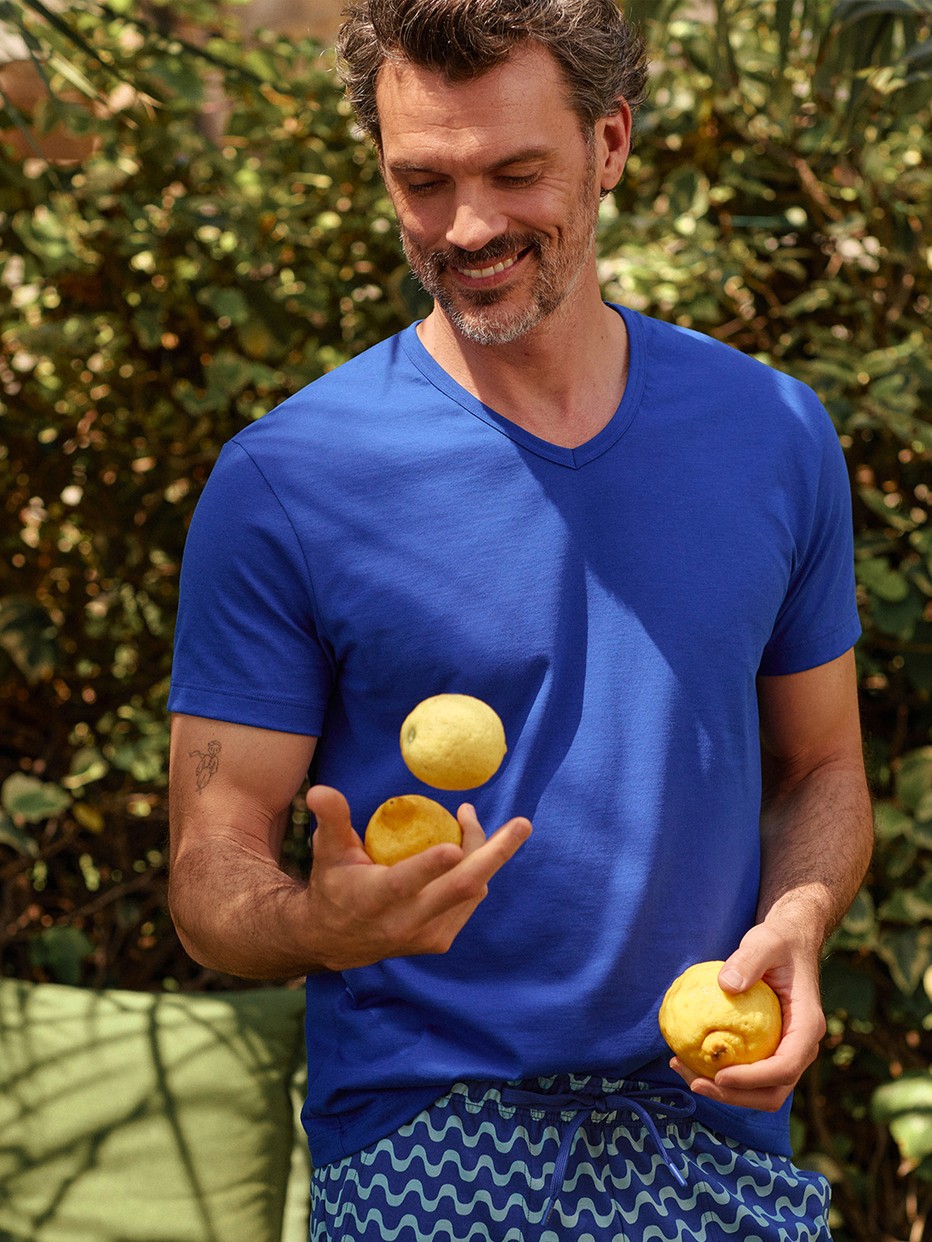 Men model is wearing Short-sleeved shirt made of 100% Cotton in Blue, Unicoloured from the RMX Sleep Time off series by CALIDA, Front view